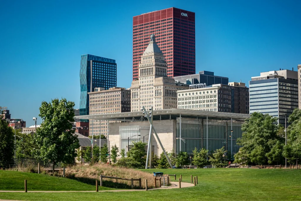 A Certified Nursing Assistant working with a patient in a healthcare setting.